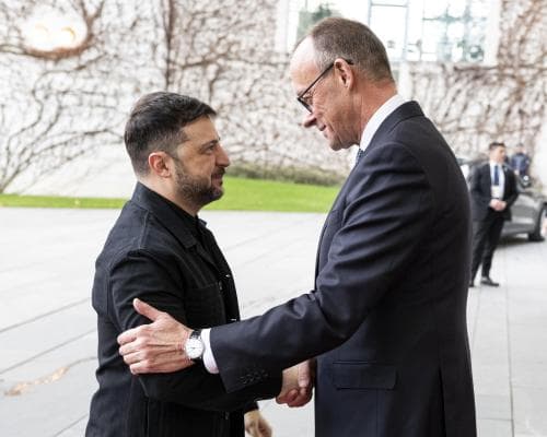 Britain’s spy chief warns Russia is an expansionist threat during Berlin talks